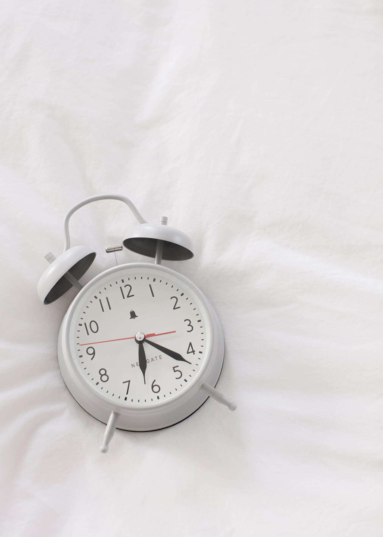Calm morning routine for women 40+ with alarm clock.