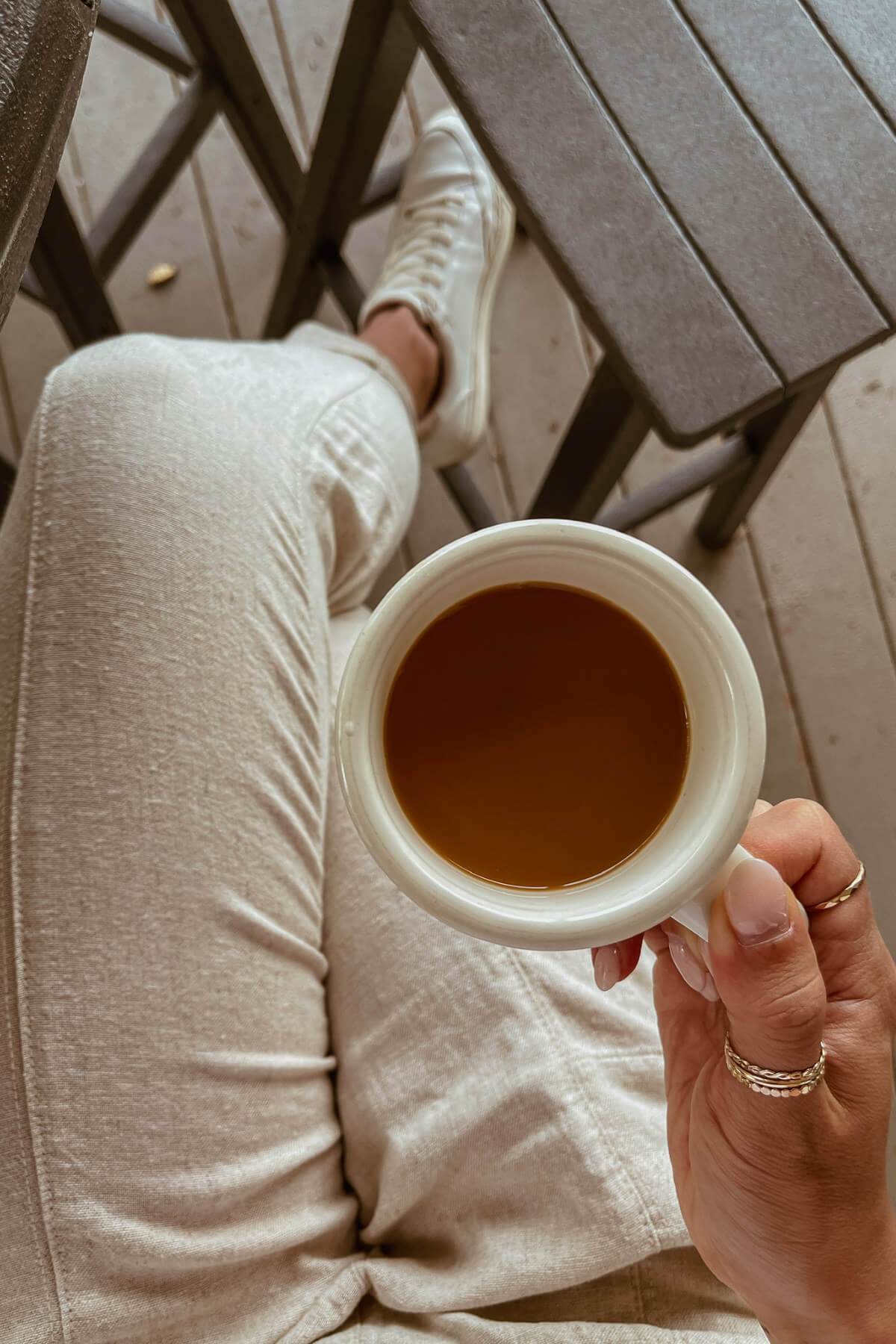 Quiet morning moment for a woman experiencing the wired but tired in midlife feeling.