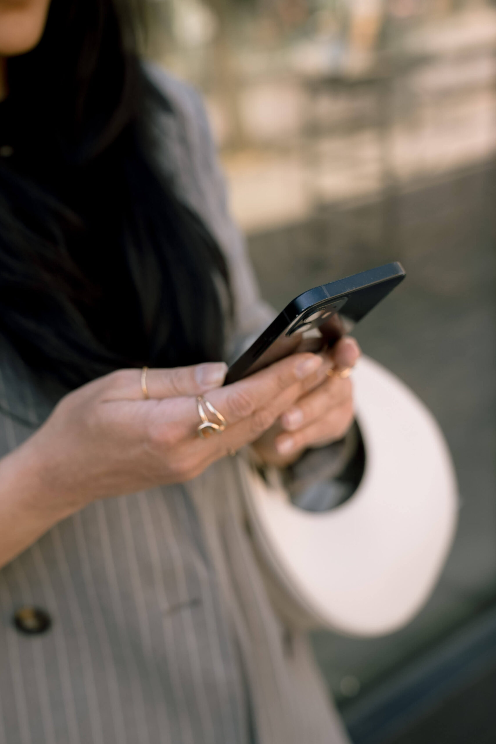 Woman looking at her phone while researching what to do